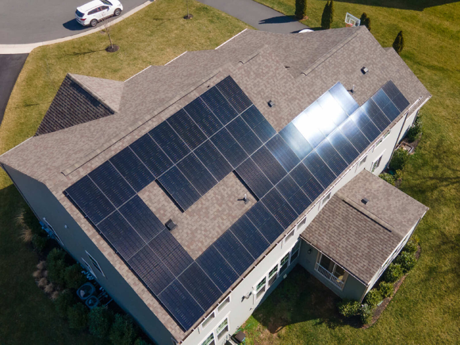 Aerial view of a residential roof with solar panels installed