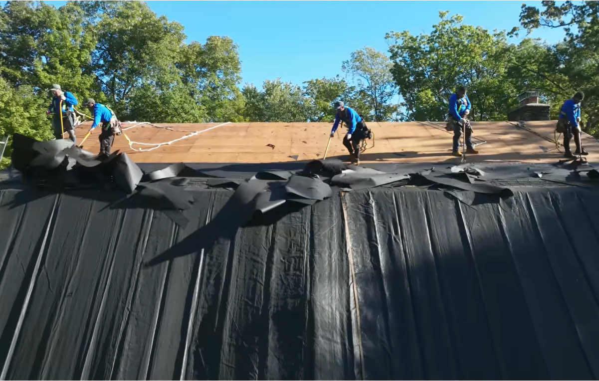 Roofing crew working on a residential roof